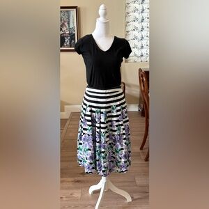 Talbots A line purple with black stripes skirt with floral design.